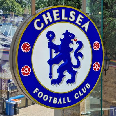 A Chelsea badge hanging in the window of the Chelsea Megastore.