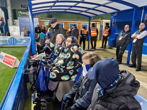 Chelsea women's team supporters in the North stand accessible area at Kingsmeadow.