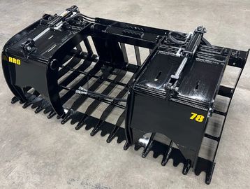 Heavy-duty black grapple attachment for heavy machinery with hydraulic components.