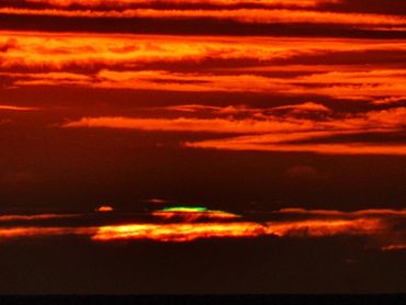"Fringing"
Occurs before the sun sets on certain days the clouds are well above the horizon.