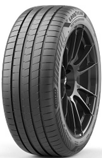 Close-up of a black car tire with detailed tread and a sleek black rim.