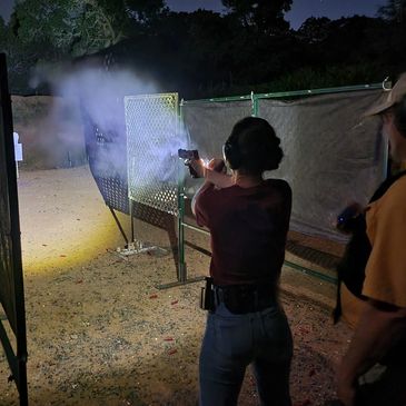 Completing the live fire portion of a women's self defense low light class.