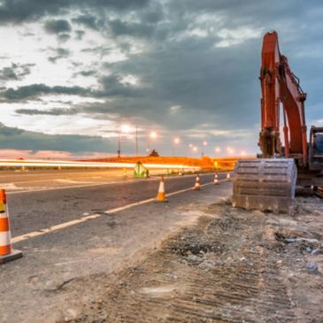 Excavator preparing a road for concrete in Columbus Ohio