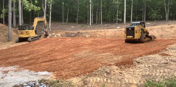 Bulldozer and excavator on a job site in Columbus Ohio preparing the land for construction