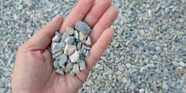 Photo of hands holding gravel with gravel in the background in Columbus Ohio