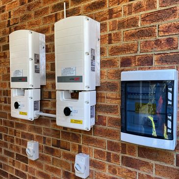 Twin solaredge inverters installed on brick wall