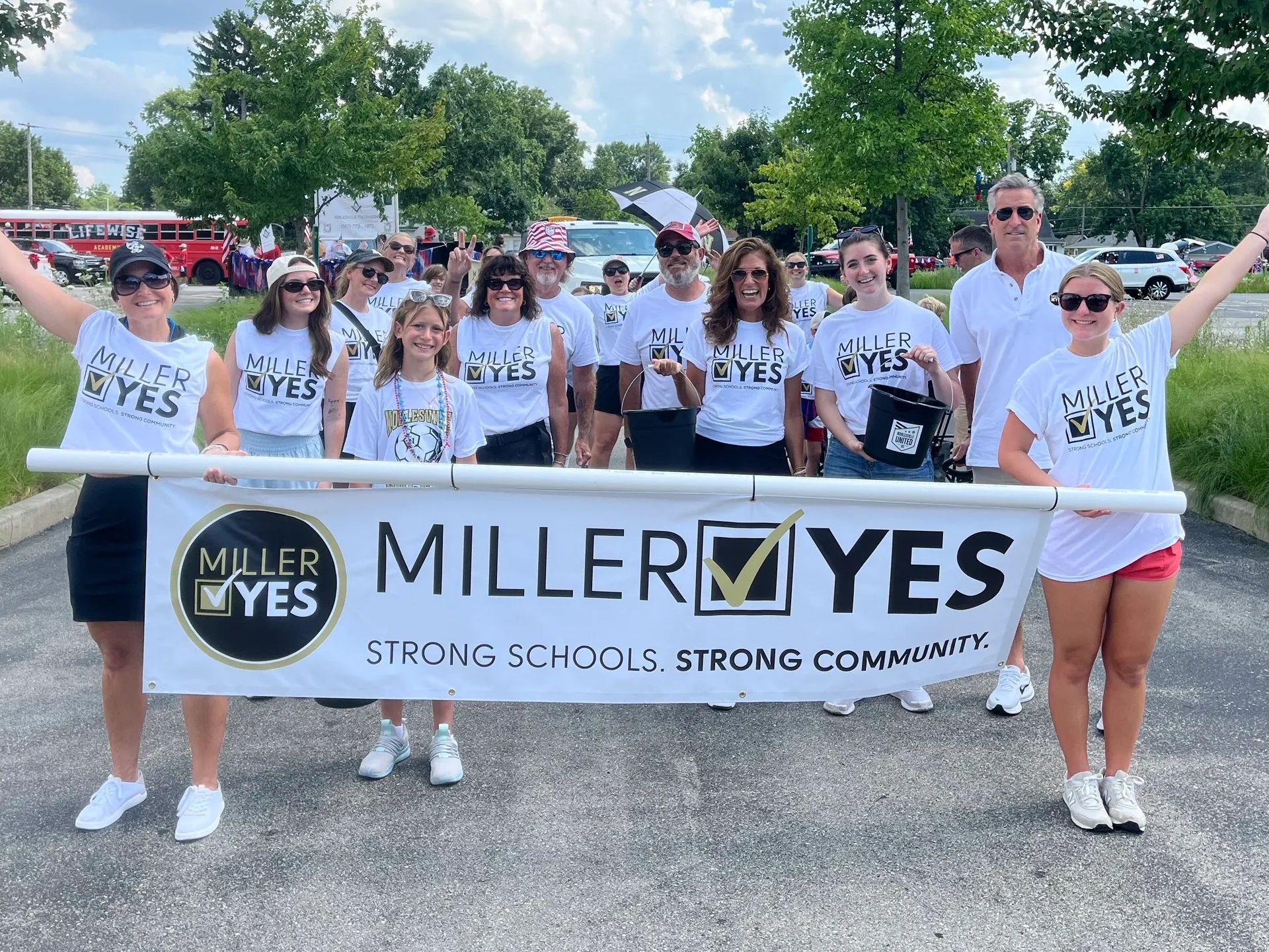 Group of supporters waving at parade