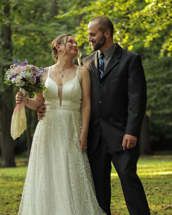 Bride and groom having a loving glance as newlyweds after our officiant performed their wedding.