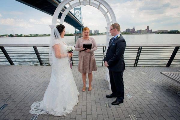 Love under the Ben Franklin Bridge at Race Street Pier in Philadelphia.