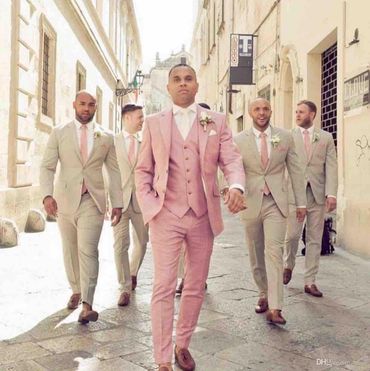 Groomsman's tan suits. Groom's Pink suit with vest. pink ties brown dress shoes. Custom made wedding
