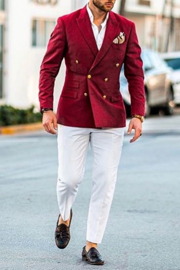 Men's red velvet blazer with white dress shirt fancy hankies and white pants