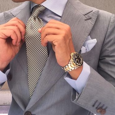 Men's light grey custom suit. Light grey custom dress shirt light grey hankie jacquard tie.