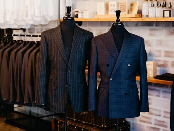 Men's made to measure suits. Custom tailored black suit with black mock neck sweater