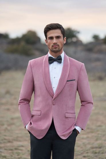 Men's custom made pink tuxedo coat. pink blazer black bow tie white tuxedo shirt.