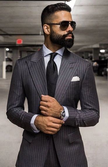 Grey pinstriped suit with light grey dress shirt hankie and black tie