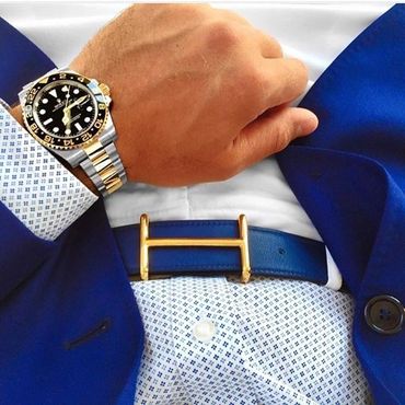Men's French blue blazer with white blue dot dress shirt blue belt white jeans with Rolex watch