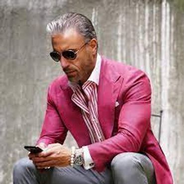pink blazer sport coat red and white striped dress shirt cuff inks light grey jeans pants