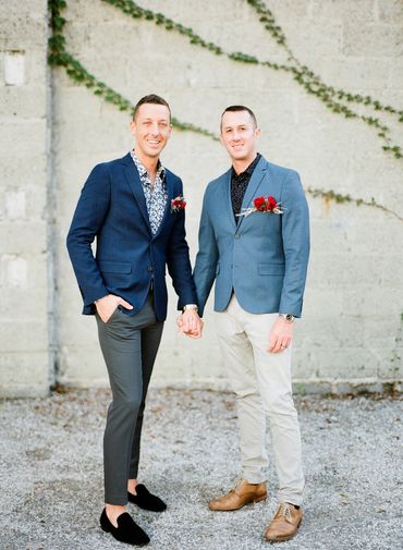 Men's blue blazer, grey pants, patterned dress shirt. Light blue blazer, tan pants, black polo shirt