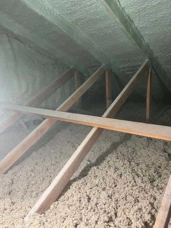 Blown-in attic insulation and spray foam air sealing in Redding, CA.