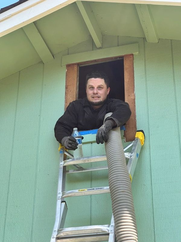 Exterior attic access used for clean insulation removal and installation service.