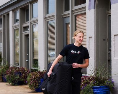 mobile massage therapist walking for an in-home visit