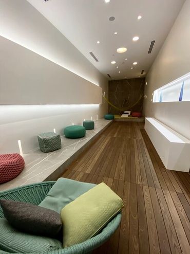 Remodel with vinyl floor and white stone, as well as pillows and other seating