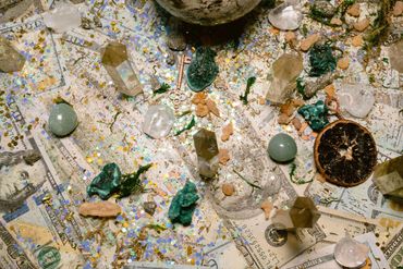 Healing Crystal Money Manifestation grid with dollar bills, gold and luxe crystals.