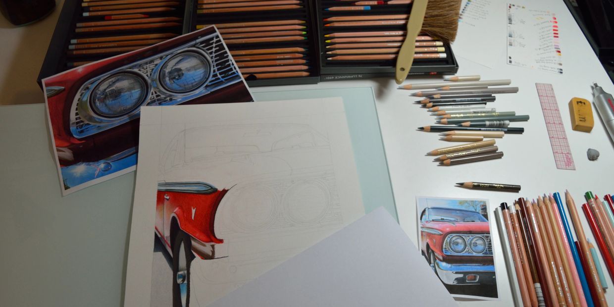 Work-in-progress colored pencil drawing of a red vintage car headlight.
