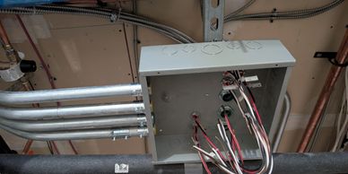 Commercial electrician, emt conduit junction box, armored cable.