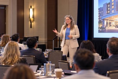 Karla Ellsworth giving a presentation to hotel owners
