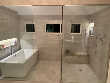 Custom wet room with shower and bathtub in downers grove