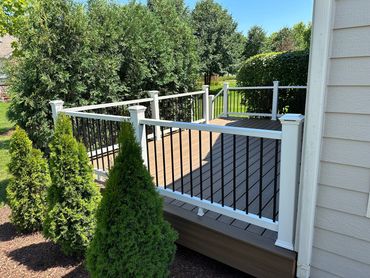 New Trex synthetic deck build with custom railings in Mokena with deck lighting