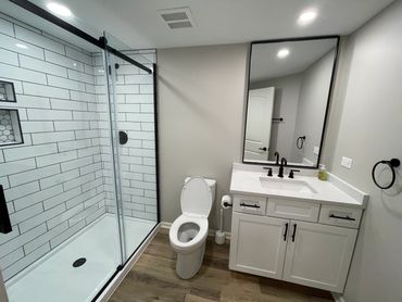 Bathroom remodel in Frankfort with custom vanity and vinyl plank flooring