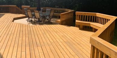 Deck construction with cedar decking and custom cedar railings. This Deck was built in Orland Park