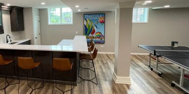 Basement remodel in Frankfort with custom wet bar and luxury vinyl plank flooring