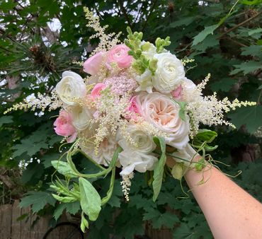 Early summer bridal bouquet filled with pink and white ranunculus & roses. Lynden, Washington 98264.