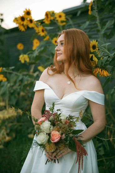 Bride with a summer flower bouquet and sunflowers. Bellingham Washington area.