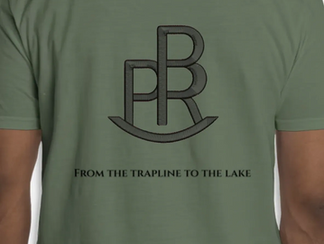 Green shirt with a stylized PR logo and slogan on the back.