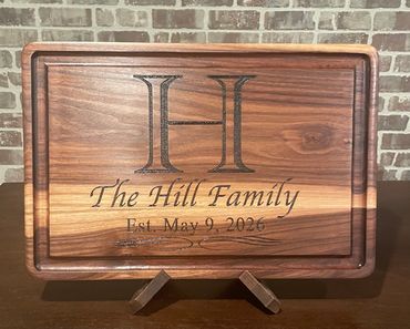 Prestige solid walnut cutting/serving board 18" x 12" x 1 1/2" with juice grooves.