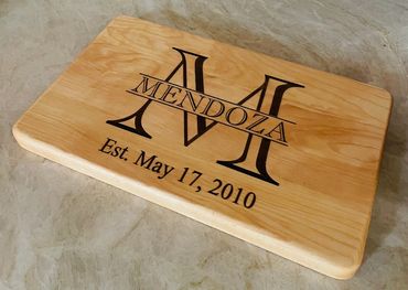 Simple Elegance is a beautiful Maple 16 x 11 x 1 personalized cutting/serving/charcuterie board.