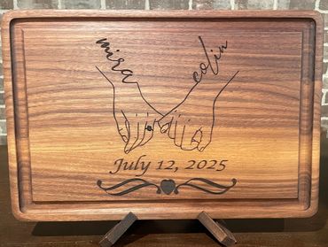 Prestige solid walnut cutting/serving board with interlocking hands design 18" x 12" x 1 1/2"