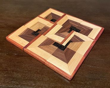 Art Deco Rebel made of walnut, maple, cherry, and mahogany, 10 1/2" x 10 1/2" x 3/8"