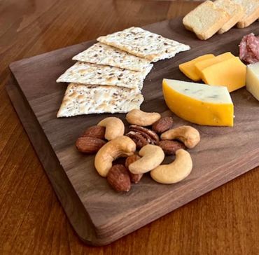 Take Flight 12 x 8 x 3/4" Walnut Flight Board on one side and charcuterie board on the other side