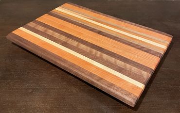 Rebel 62 Beautiful EDGE grain exotic hardwoods Cutting/Serving Board ,
18" x 12" x 1 1/2"