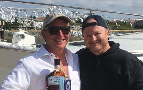 Captain George Kellner 25 306-2516 gifts new owner his first complimentary bottle of Gentleman Jack, in celebration of purchase of his Bayliner 3888!