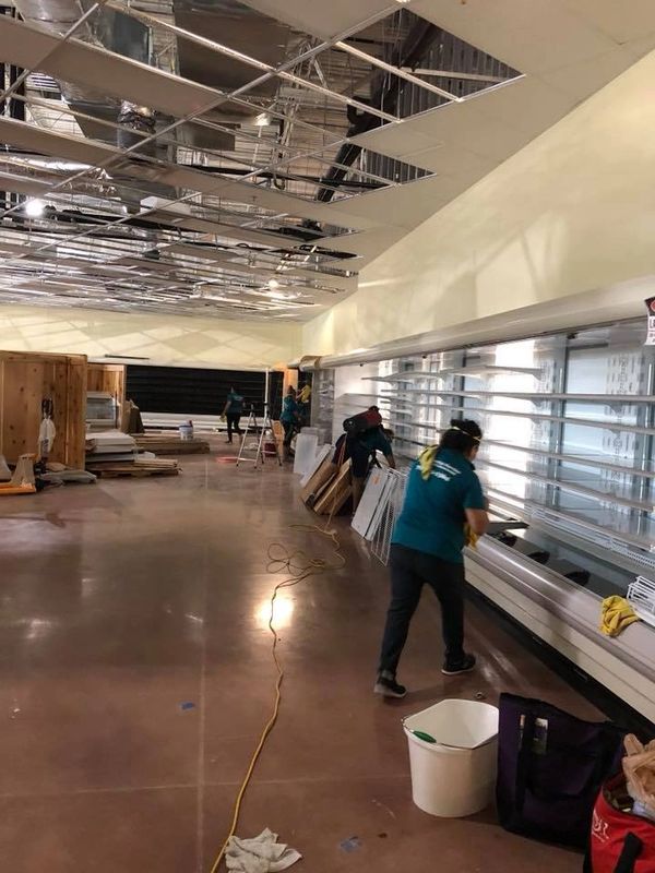 A Woman Cleaning a Commercial Room