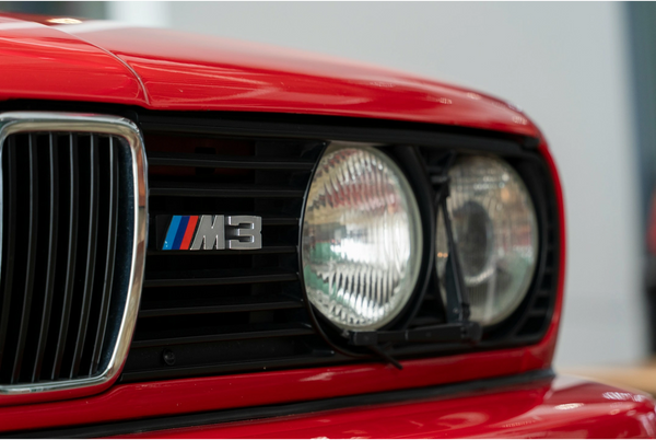 Classic BMW M3 Front View | Iconic Red Sports Car with Distinctive Grille and Headlights