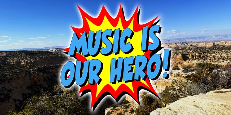 Comic-style text says "Music is our hero!" over a canyon background.