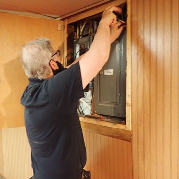 Inspector inspecting a electrical panel