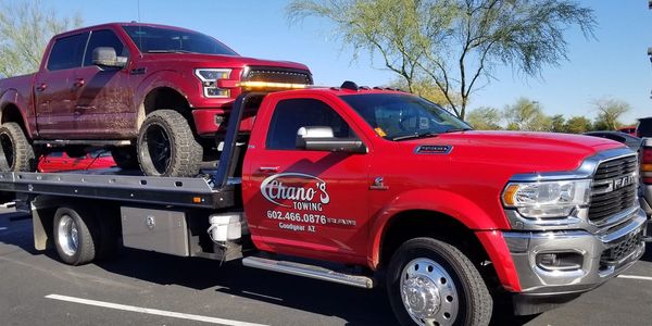 Chano's Towing can tow it all. This tow truck is towing a lifted off road Ford truck to Buckeye, AZ.